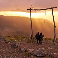Buy canvas prints of Romantic couple swinging on a Swing baloico in Lousa mountain, Portugal at sunset by Luis Pina