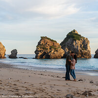 Buy canvas prints of Couple kissing on a wild empty beach in Ribeiro do Cavalo, Arrabida, Portugal by Luis Pina