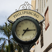 Buy canvas prints of Clock from Shopping area on Back Street in Philips by Miro V
