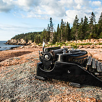 Buy canvas prints of Antique typewriter near ocean on granite rock by Miro V