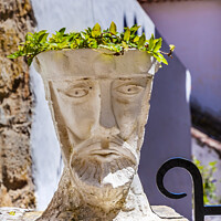 Buy canvas prints of White Head Sculpture Street Obidos Portugal by William Perry