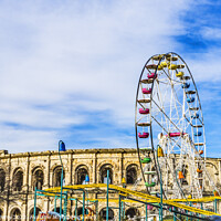 Buy canvas prints of Christmas Amusement Rides  Roman Arena Amphitheatre Nimes Gard F by William Perry