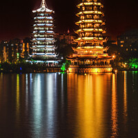 Buy canvas prints of Gold Silver Pagodas Night Illuminated Guilin China by William Perry