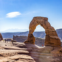 Buy canvas prints of Delicate Arch Tourists Rock Canyon Arches National Park Moab Uta by William Perry