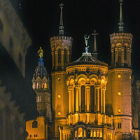 Buy canvas prints of Basilica of Notre Dame Illuminated Outside From Downtown Lyon Fr by William Perry
