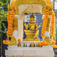 Buy canvas prints of Golden Yellow Buddha Spirit House Downtown Bangkok Thailand by William Perry