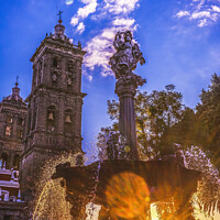 Buy canvas prints of Arcangel Fountain Zocalo Park Plaza Cathedral Sunset Puebla Mexi by William Perry