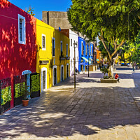 Buy canvas prints of Red Yellow Blue Colorful Shopping Street Puebla Mexico by William Perry