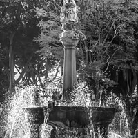 Buy canvas prints of Black and White Arcangel Fountain Zocalo Park Plaza Puebla Mexic by William Perry