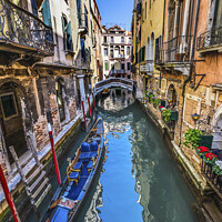 Buy canvas prints of Colorful Gondola Small Side Canal Bridge Venice Italy by William Perry