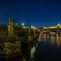Buy canvas prints of Panoramic cityscape view of Charles Bridge over Vltava river locate in Prague in Czech Republic during night sky by Arpan Bhatia