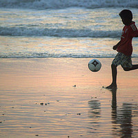 Buy canvas prints of Kid playing in Goa beach by Arpan Bhatia