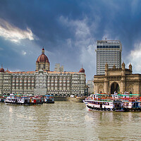 Buy canvas prints of Mumbai, India: Wide angle shot of Gateway of India and Taj hotel against sea and dramatic cloudy sky by Arpan Bhatia