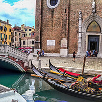 Buy canvas prints of Venice, Italy -Wide angle panorama shot of venzia bridge over canal next to gandola boats against church by Arpan Bhatia