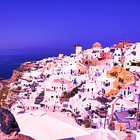 Buy canvas prints of Santorini, Greece: Beautiful city of Oia ( Ia ) on a hill of white houses with blue roof and windmills against dramatic pink sky, located in Greek Cyclades islands in Mediterranean sea by Arpan Bhatia