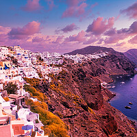 Buy canvas prints of Santorini, Greece: Beautiful city of Oia ( Ia ) on a hill of white houses with blue roof against dramatic pink sky, located in Greek Cyclades islands in Mediterranean sea by Arpan Bhatia