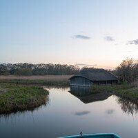 Buy canvas prints of Reflections and boat at Hickling Broad by Christopher Keeley