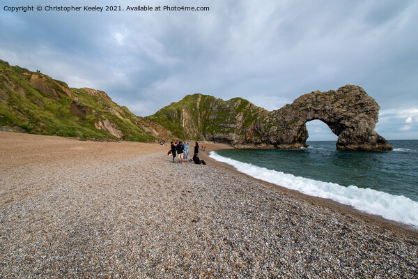 Durdle Door and tourists Picture Board by Christopher Keeley