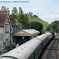 Buy canvas prints of A steam train at Corfe Castle by Christopher Keeley