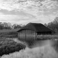 Buy canvas prints of Hickling Broad boat house in black and white by Christopher Keeley