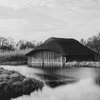 Buy canvas prints of Hickling Broad boat house in monochrome by Christopher Keeley