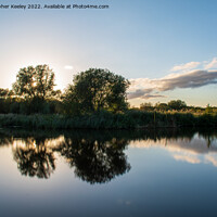 Buy canvas prints of Dusk reflections on Norfolk Broads by Christopher Keeley