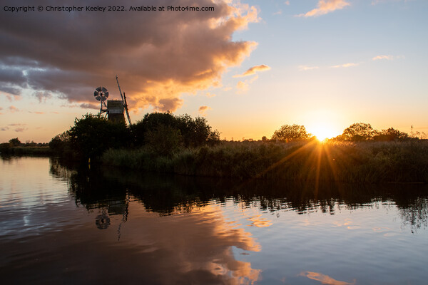Turf Fen windmill sunset Picture Board by Christopher Keeley