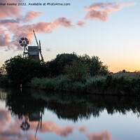 Buy canvas prints of Sunset reflections at How Hill windmill by Christopher Keeley