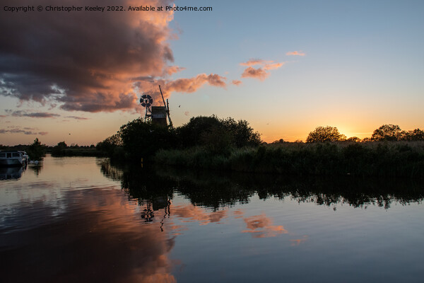 Norfolk Broads windmill sunset Picture Board by Christopher Keeley