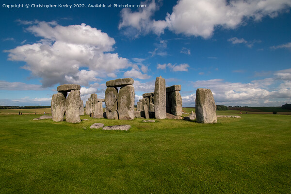Blue skies over Stonehenge Picture Board by Christopher Keeley