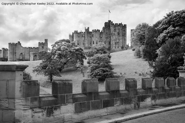 Alnwick Castle in black and white Picture Board by Christopher Keeley