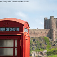 Buy canvas prints of Bamburgh Castle red telephone box by Christopher Keeley