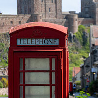 Buy canvas prints of Telephone box at Bamburgh Castle by Christopher Keeley
