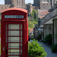Buy canvas prints of Red telephone box and Bamburgh Castle by Christopher Keeley