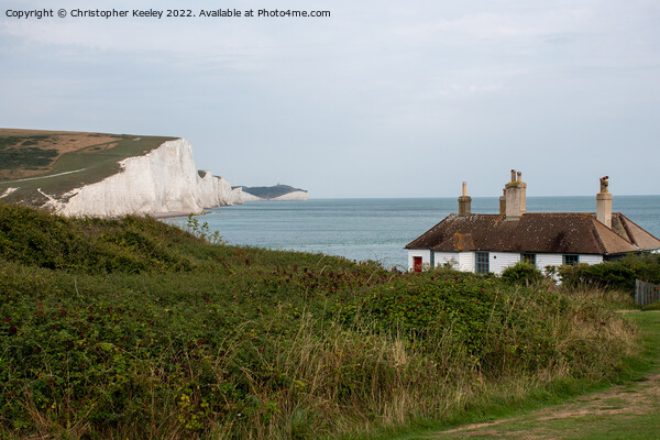 Seven Sisters Cliffs and coastguard cottages Picture Board by Christopher Keeley