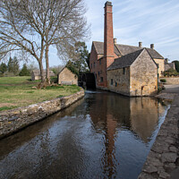 Buy canvas prints of The Old Mill at Lower Slaughter in the Cotswolds by Christopher Keeley