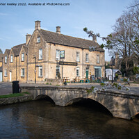 Buy canvas prints of Bourton-on-the-Water in the Cotswolds by Christopher Keeley