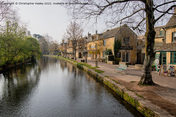 Early morning in Bourton-on-the-Water Picture Board by Christopher Keeley