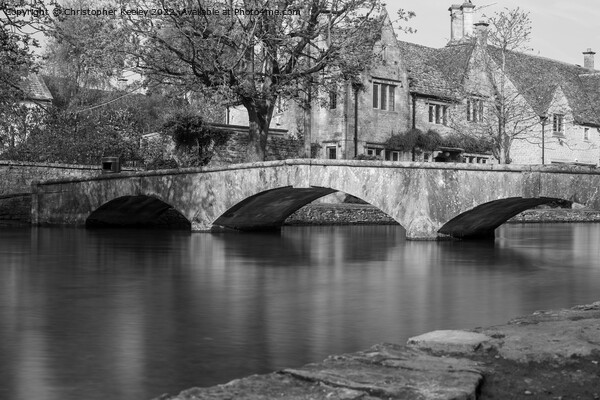 Enchanting Stone Bridge in Bourton-on-the-Water Picture Board by Christopher Keeley