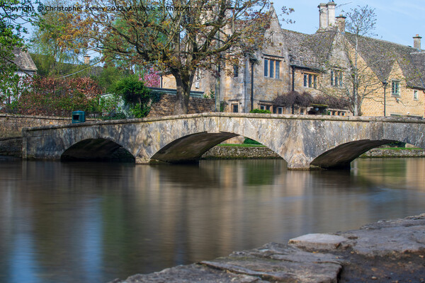 Stone bridge in Cotswolds Bourton-on-the-Water Picture Board by Christopher Keeley