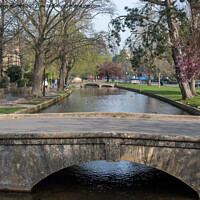 Buy canvas prints of Bourton-on-the-Water in the Cotswolds by Christopher Keeley