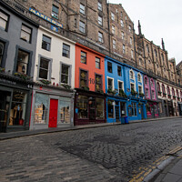 Buy canvas prints of Colourful row of shops on Victoria Street, Edinburgh by Christopher Keeley