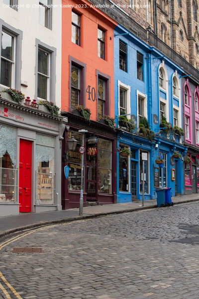 Row of colourful shops on Victoria Street, Edinburgh Picture Board by Christopher Keeley