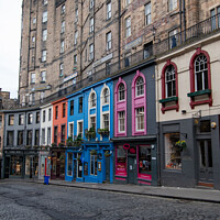 Buy canvas prints of Colourful shop row on Victoria Street, Edinburgh by Christopher Keeley