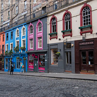 Buy canvas prints of Victoria Street colourful shop fronts in Old Town, Edinburgh by Christopher Keeley