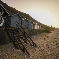 Buy canvas prints of Sunset over Cromer beach huts by Christopher Keeley
