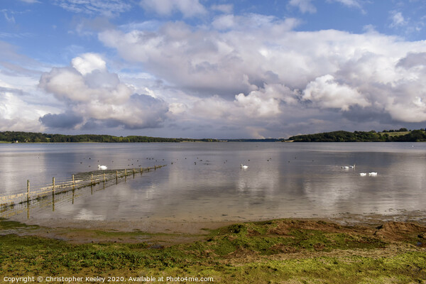 Cloudy skies over Rutland Water Picture Board by Christopher Keeley