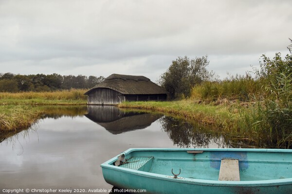 Hickling Broad boat houses Picture Board by Christopher Keeley