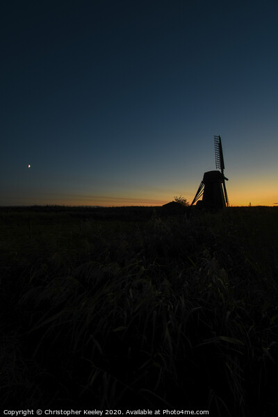 Sunset over Herringfleet Windmill  Picture Board by Christopher Keeley