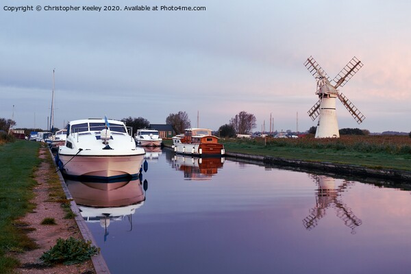 Sunrise at Thurne Mill Picture Board by Christopher Keeley